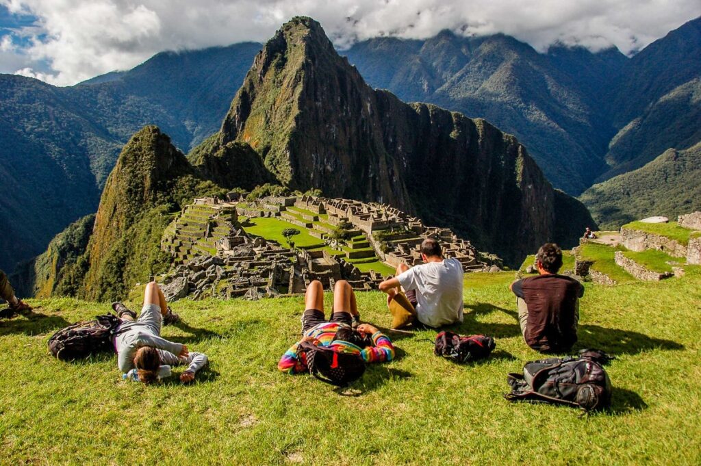 Happy travelers posing at Machu Picchu after completing the Salkantay Trek from Cusco