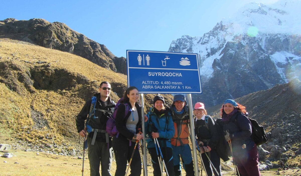 Hiking boots and trekking poles for a Salkantay Trek packing list