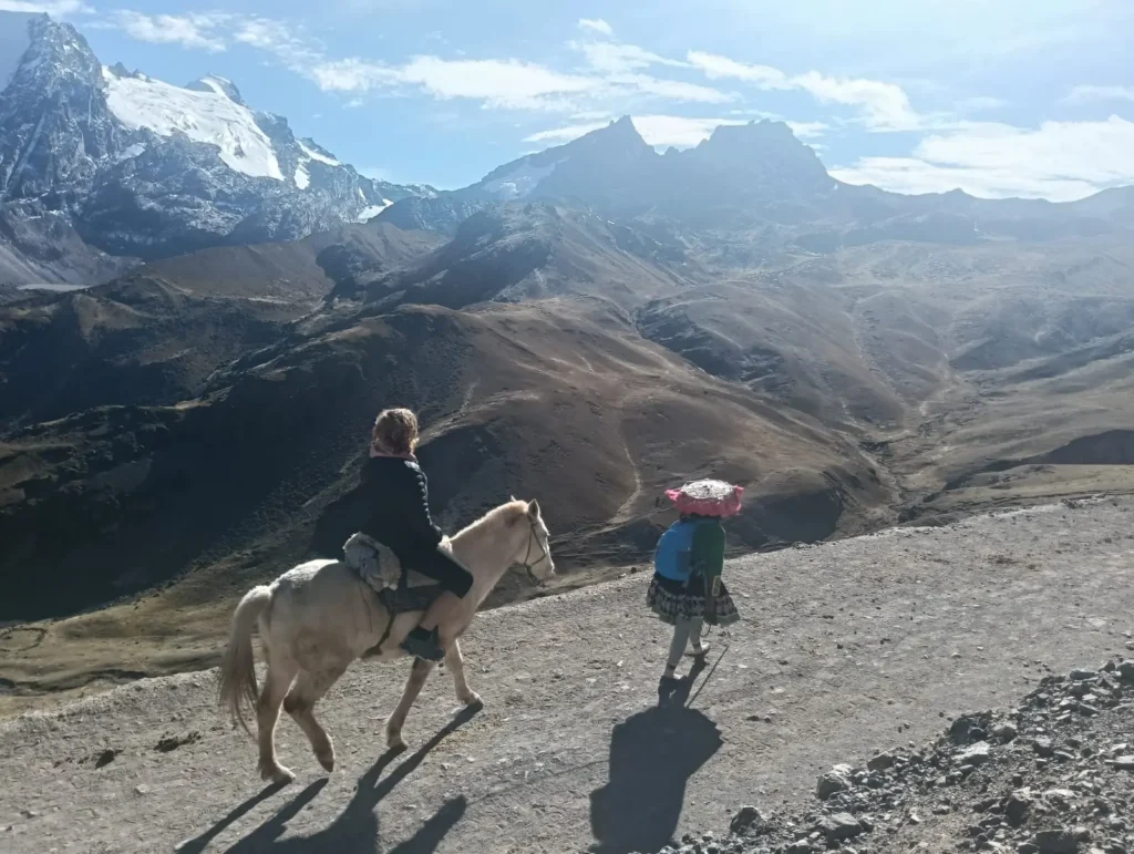Panoramic view from the summit with snow capped peaks behind