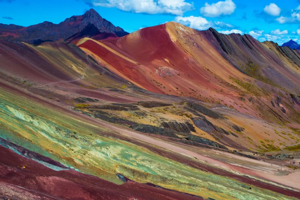 Hikers crossing the colorful summit at 5,200 meters