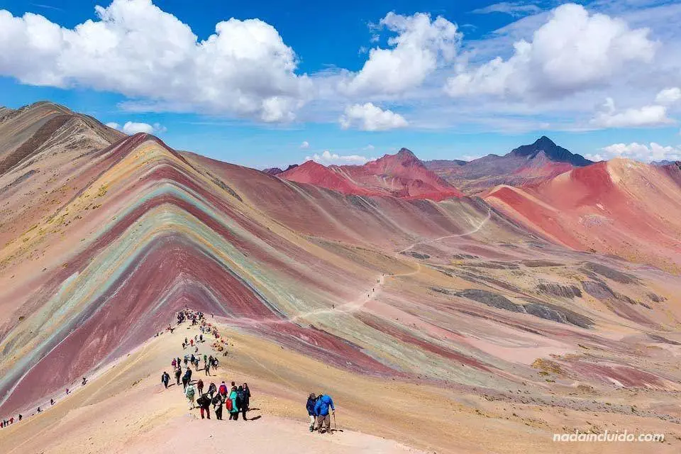 Rainbow Mountain Cusco tour group hiking the colorful trail