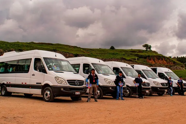 Local transport van driving through a scenic Andean valley road