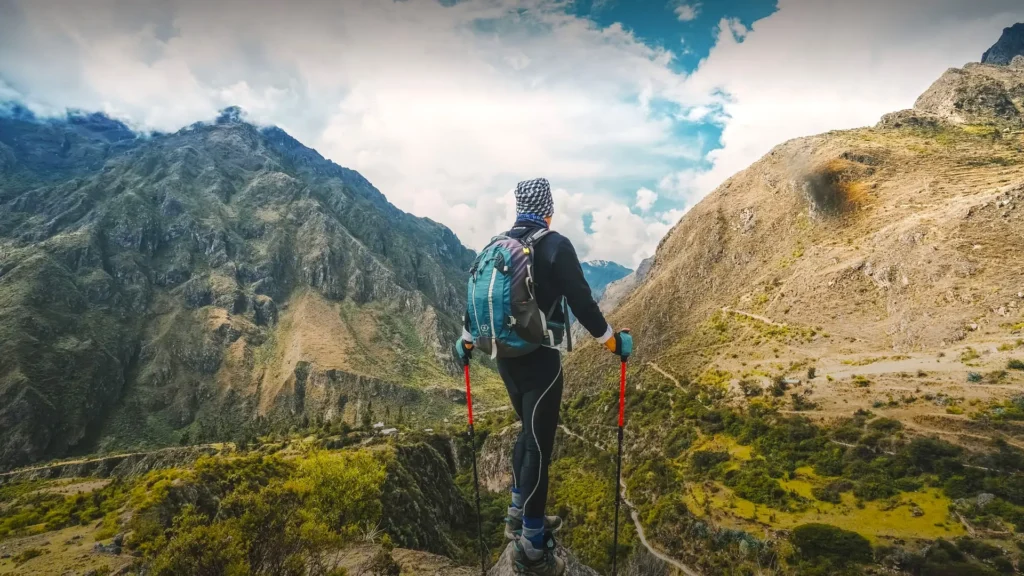 Hiking gear and daypack laid out for a 2-day trek on ancient stone paths in the Andes