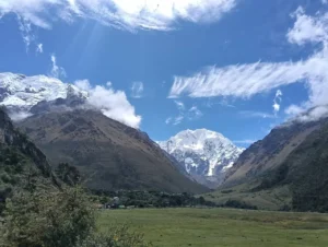 Salkantay trek 4 days panoramic view of the snow-capped Salkantay peak at sunrise from base camp