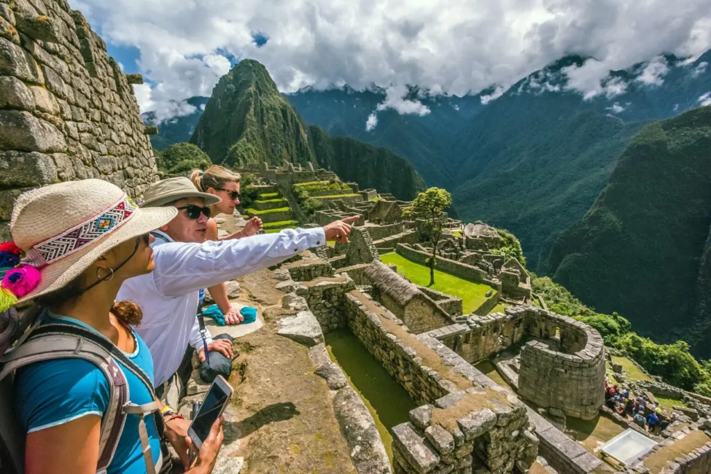 Machu Picchu tours guide explaining the Temple of the Sun to visitors