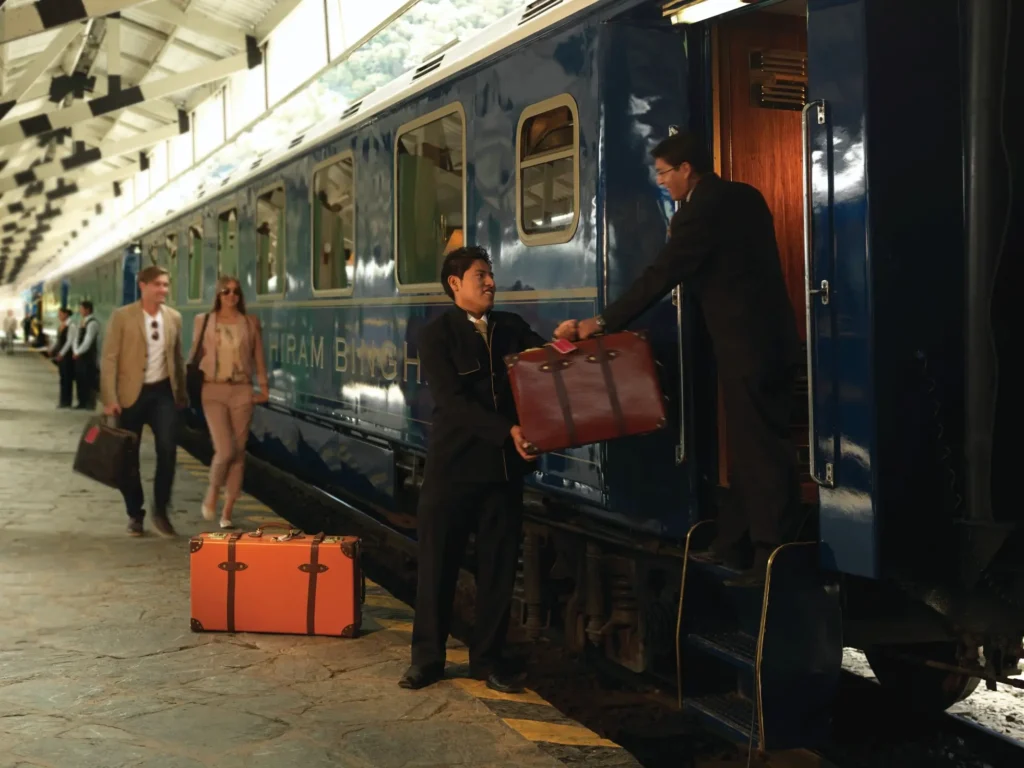 Historic luxury train at a Peruvian mountain station before departure