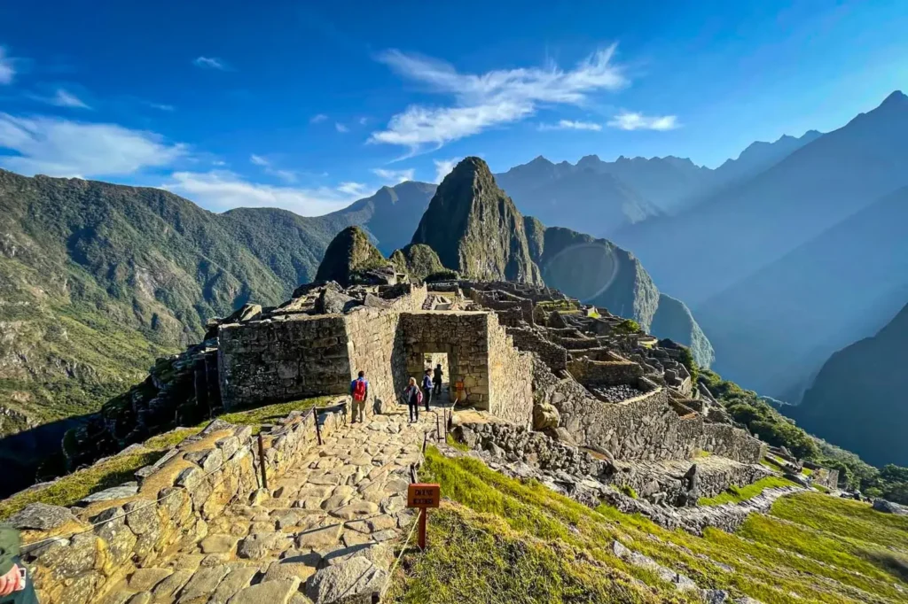 Machu Picchu luxury tours private guide at sunrise with ancient citadel behind